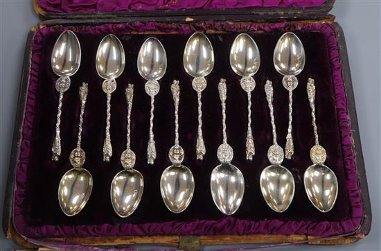 A matched cased set of twelve silver apostle spoons, Edward Hutton, London, 1885/6 and London, 1880.